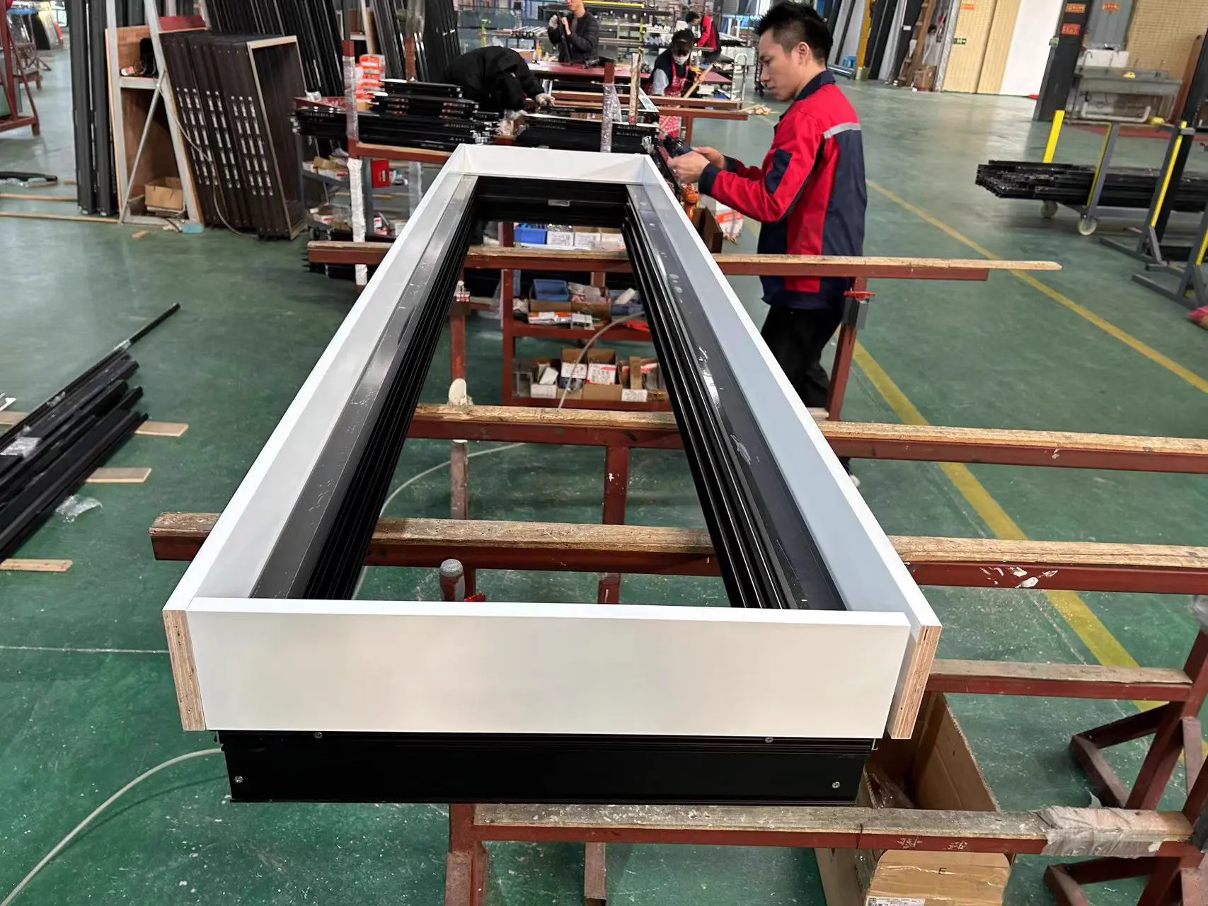 Assembling door frames for a villa project on the production line